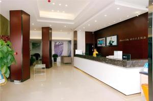 a lobby of a hotel with a reception counter at City Comfort Inn Hotel Zhangjiajie Railway Station Tianmen Mountain Cableway Station in Zhangjiajie