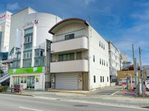 a large white building on a city street at Kawaramachi Grande Joy in Takamatsu