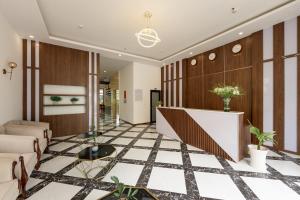 a lobby with a checkered floor at Hygg Hotel Phu Quoc in Phu Quoc