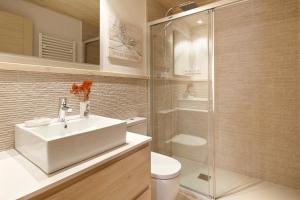 a bathroom with a white sink and a shower at Val de Ruda Luxe 42 by FeelFree Rentals in Baqueira-Beret +12 photos