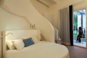 Postel nebo postele na pokoji v ubytování Calapetra Resort