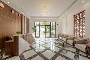 a lobby with a glass table and couches at Hygg Hotel Phu Quoc in Phu Quoc +19 photos
