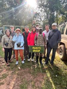 a group of people posing for a picture at Brian's wild safaris in Fort Portal