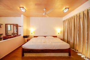 Postel nebo postele na pokoji v ubytování Dilco Nature Resort & Spa