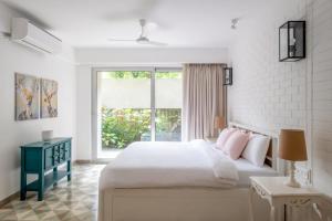 Ένα ή περισσότερα κρεβάτια σε δωμάτιο στο Cosmos Oasis by Da Alohas, Luxury 2BHK at Candolim