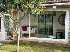 a screened in porch with a couch and a table at Villa Charita - Old Masseria in the historical town with private pool in Castrignano del Capo