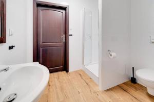 a bathroom with a toilet and a sink and a shower at Folwark Żabowo in Glinojeck +20 photos