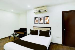 Ένα ή περισσότερα κρεβάτια σε δωμάτιο στο Hotel Srida Jaipur
