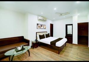 Ένα ή περισσότερα κρεβάτια σε δωμάτιο στο Hotel Srida Jaipur +5 φωτογραφίες
