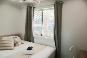 a bedroom with a bed with a stuffed animal on it at Double room with shared bathoom in Auburn