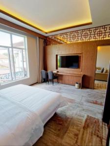 Postel nebo postele na pokoji v ubytování 鸿业远图酒店