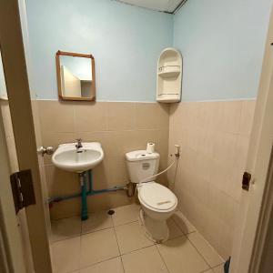 a bathroom with a toilet and a sink at Lam Sai village hotel Koh Yao Noi in Ko Yao Noi
