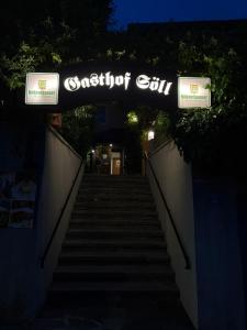 a set of stairs with a sign that reads satisfaction club at Gasthof Söll in Niedertaufkirchen