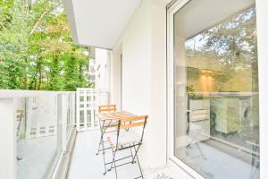 a chair on the balcony of a house at Candella in Strasbourg