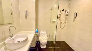 a bathroom with a sink and a toilet and a shower at Abdullah Residence in Patong Beach +38 photos