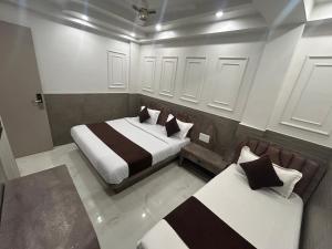 a bedroom with two beds in a room at Hotel Shree Guru Couple Friendly Main Bazar Paharganj New Delhi in New Delhi +10 photos