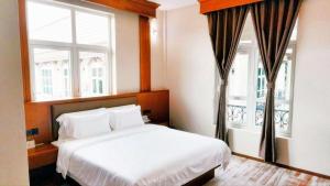 Postel nebo postele na pokoji v ubytování 鸿业远图酒店 + 126 fotografií