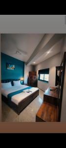 Postel nebo postele na pokoji v ubytování Hotel Baroda Rooms & Banquet