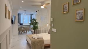a bedroom with a bed and a dining room at Viana apartaments in Bilbao +36 photos