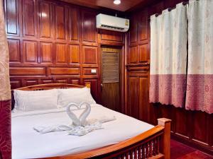 Giường trong phòng chung tại Sukhum Ban Songthai