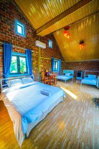 Ένα ή περισσότερα κρεβάτια σε δωμάτιο στο Phong Nha An An Villa Retreat