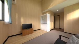 Μια τηλεόραση ή/και κέντρο ψυχαγωγίας στο ペンションハートウォーマー