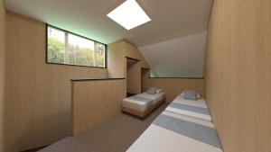 Ένα ή περισσότερα κρεβάτια σε δωμάτιο στο ペンションハートウォーマー