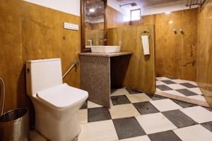 a bathroom with a toilet and a sink at The Mayara Fort Jaisalmer Camps in Jaisalmer +8 photos