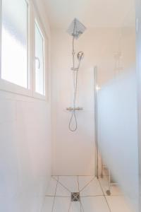 a white bathroom with a shower and a window at Villa individuelle Nernier proche lac in Nernier +25 photos