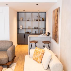 a living room with a couch and a table at Hotel Ari Gjakove in Gjakove +21 photos