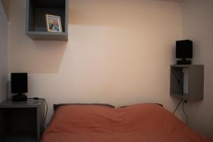 En eller flere senge i et værelse på Au Fil Des Vagues + 8 billeder