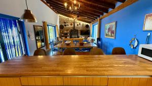 a dining room with a large wooden table and chairs at Casa Rural Madre del Agua. Finca El Robledillo in Monesterio
