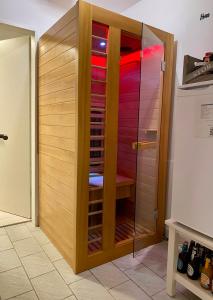 a wooden wine cellar with a glass door at Ferienwohnung Rantum in Heide