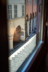 a view of a street from a window at LHE Les Trois Merveilles Rosé Charles in Cesena