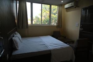 Voodi või voodid majutusasutuse Hotel arti cottage toas