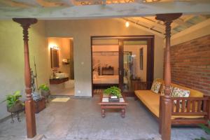 a living room with a couch and a table at Dhyana Beach Villa in Ambalangoda +38 photos