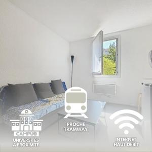 a white room with a bed and a window at Studio meublé à Lyon Centre in Lyon