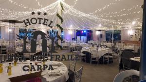 a room filled with tables and chairs with lights at Hotel Resort Cueva del Fraile in Cuenca +78 photos