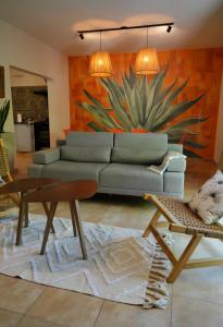 a living room with a couch and a table at Casa Frida in Villa Carlos Paz