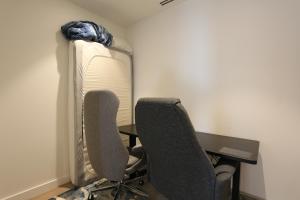 a room with two chairs and a desk and a mattress at Ultra Luxury 1BR with Study beside Crown Sydney, with All AMENITIES! And sleeps 4! in Sydney +24 photos