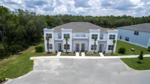 an aerial view of a white house at Cozy 3bd 3bath @HiddenForest with pool in Orlando