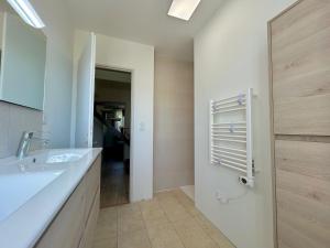 a bathroom with a sink and a mirror at Colocation Étudiante bompas in Bompas