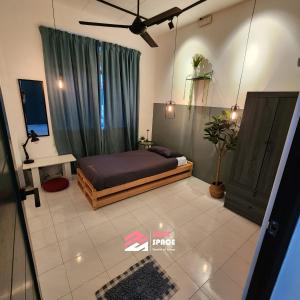 a bedroom with a bed in a room with a window at Rent Space Coliving Bandar Hilir Melaka in Melaka