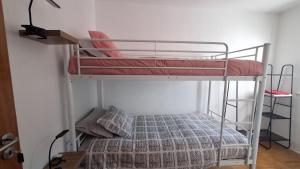 Ένα ή περισσότερα κρεβάτια σε δωμάτιο στο Pescadores GuestHouse