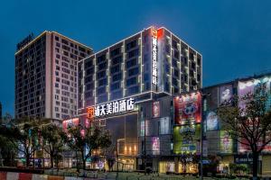 a large building with signs on the side of it at 上海浦天美泊酒店 in Shanghai