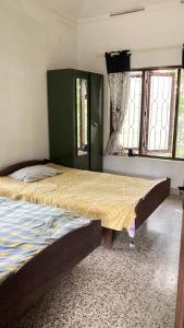 Ένα ή περισσότερα κρεβάτια σε δωμάτιο στο Varijam