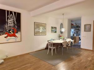 a living room with a table and a dining room at Spacious Apartment in Sodermalm in Stockholm