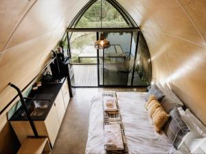 a room with a bed in a dome shaped room at Rosemary Hill Farm in Pretoria