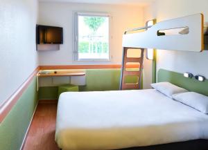 Postel nebo postele na pokoji v ubytování ibis budget Metz Sud