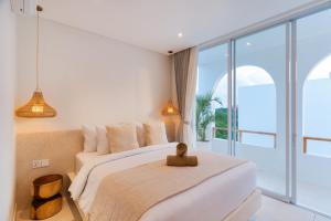 Ένα ή περισσότερα κρεβάτια σε δωμάτιο στο Villa Valli 4, Luxury Mediterranean Villa Bingin